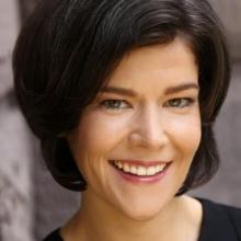 woman with short dark hair smiling