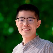 man with glasses smiling