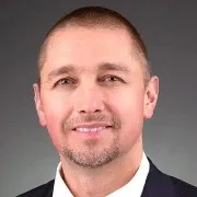 man with buzz cut smiling