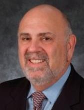 man in a suit smiling