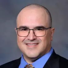 man with glasses on smiling