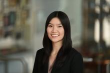 female with dark hair smiling
