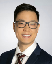 male smiling with glasses, dark hair