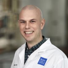 man in doctor coat smiling