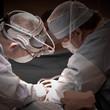 Drs. Bryan Burt and David J. Sugarbaker performing thoracic surgery.