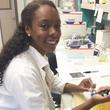 Kailand Thompson, the 2015 SMART Program college intern, mentors in Dr. Carolina Jorgez's lab.