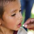 A child receiving vaccine medicine.