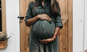 Woman holding her pregnant stomach