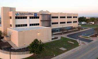 The Temple campus of Baylor College of Medicine. A large tan brick building.