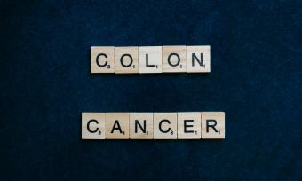 Colon Cancer spelled out in scrabble tiles.