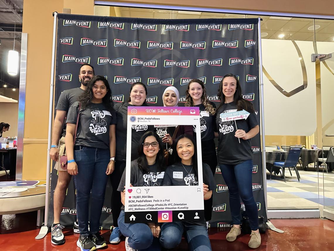 group of people in matching tshirts smiling