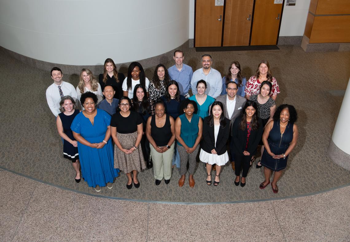 an overhead view of a group of people smiling