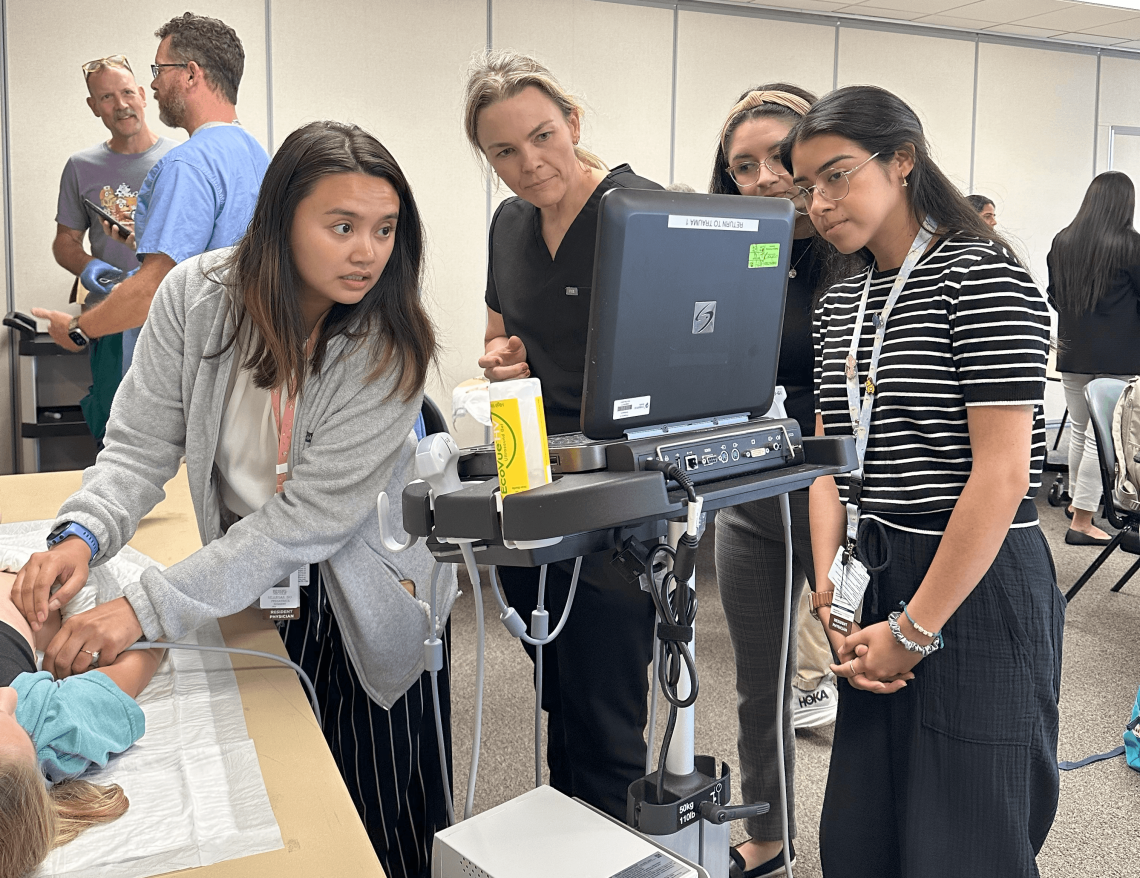Interns participate in a simulation lab with ER attendings