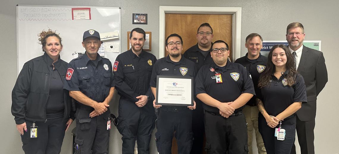 group of first responders standing in front of a wall