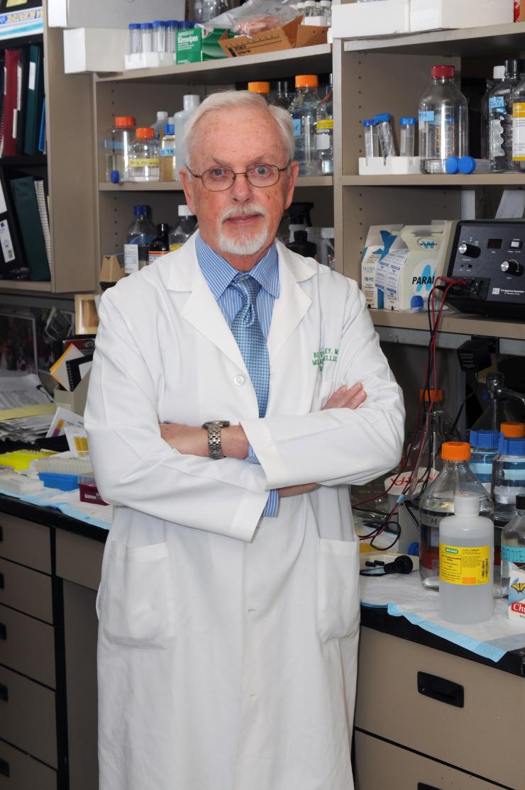 Dr. Burt O'Malley standing in his research lab.