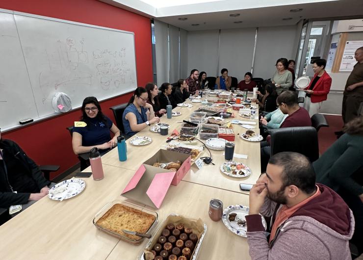 Photo of people at a table full of food