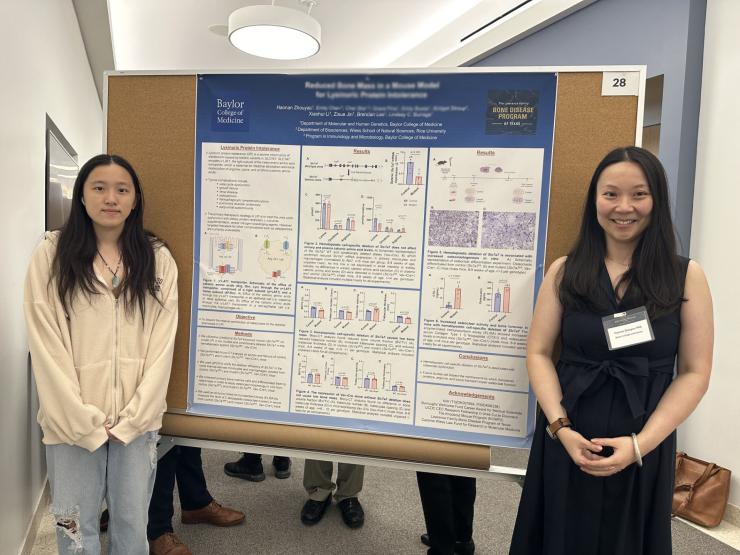 people standing in front of a poster