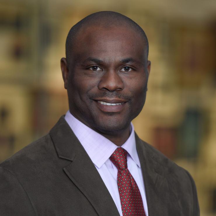 man with a red tie on smiling