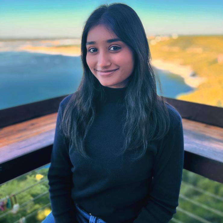 Woman standing in front of a beach