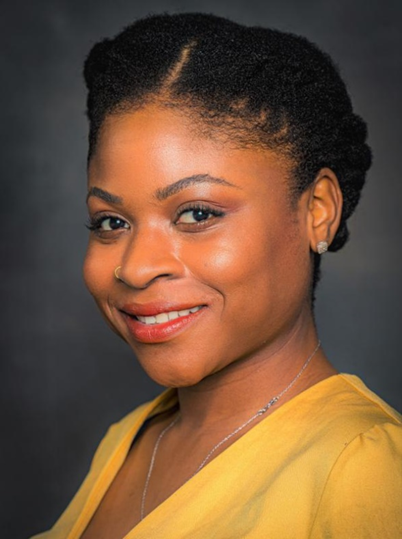 woman in a yellow top smiling