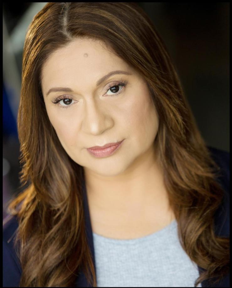 woman with long hair smiling lightly