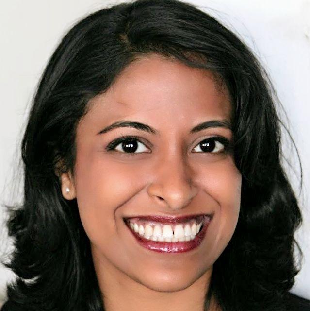 woman with long dark hair smiling