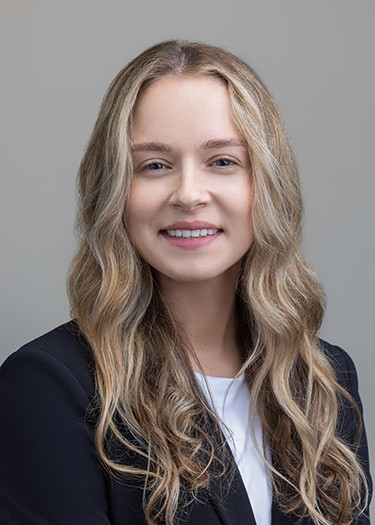 woman with long blonde hair smiling