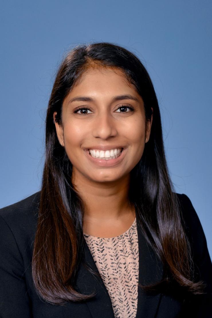 woman with long dark hair smiling