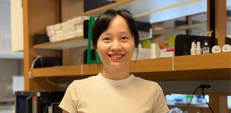 woman smiling in a lab