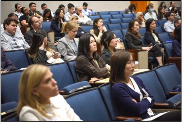 people sitting in an auditorium