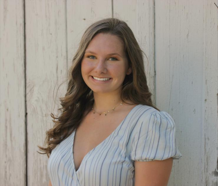 woman with light brown hair smiling