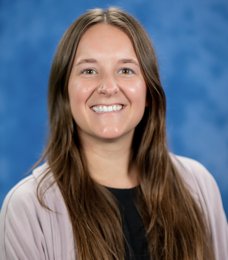 woman with long brown hair smiling
