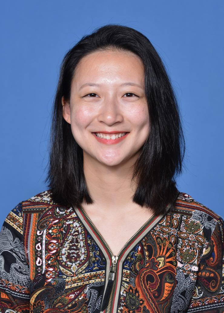 woman with medium-length dark hair smiling