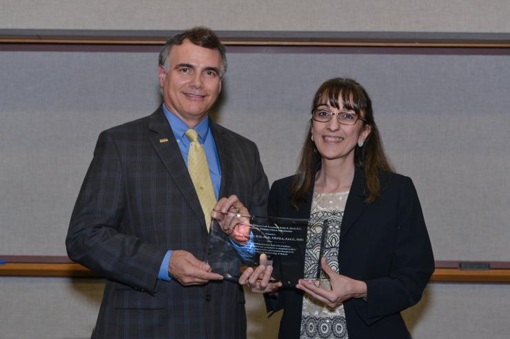Dr. Adam Kuspa, senior vice president and dean of research at Baylor with Ben and Margaret Love Foundation Bobby Alford Award for Academic Clinical Professionalism award winner Biykem Bozkurt, M.D., Ph.D., professor of medicine – cardiology.