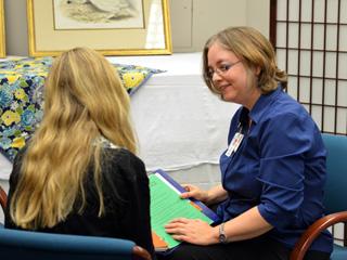 Melody Fregia, M.A., LPC, counsels a patient.