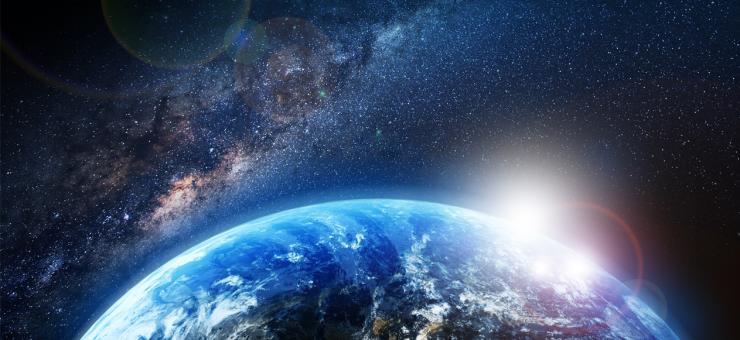 Aerial view of stars and earth from space.