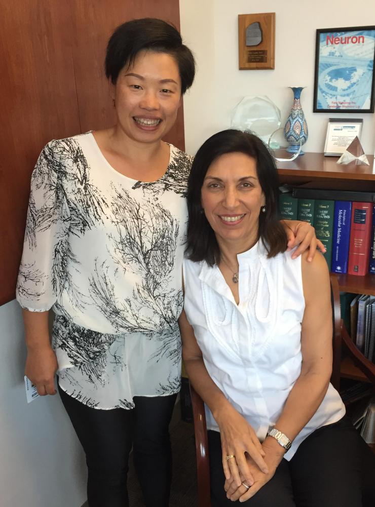 Dr. Hui Lu and her mentor, Dr. Huda Zoghbi