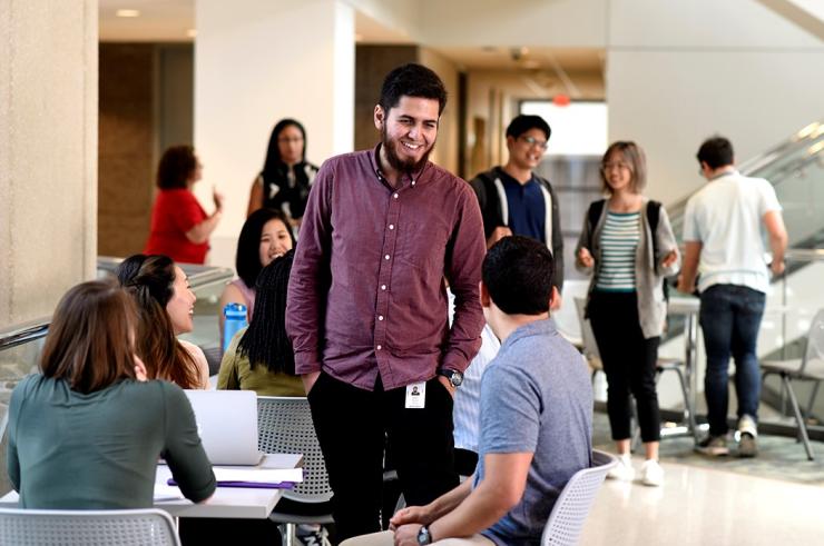 Graduate students gathering on campus.