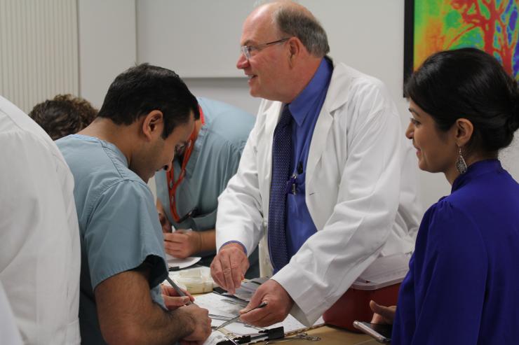 Dr. Matthew Wall keeps score at the 2018 Surgical Skills Olympics
