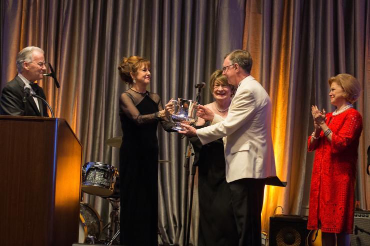 Peggy Carrington, Cora Sue Mach honor Dan L Duncan Comprehensive Cancer Center Director Dr. Kent Osborne during the Café Society Soiree.