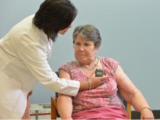 Clinician adjusts a patient control device which allows the patient to monitor her therapy.