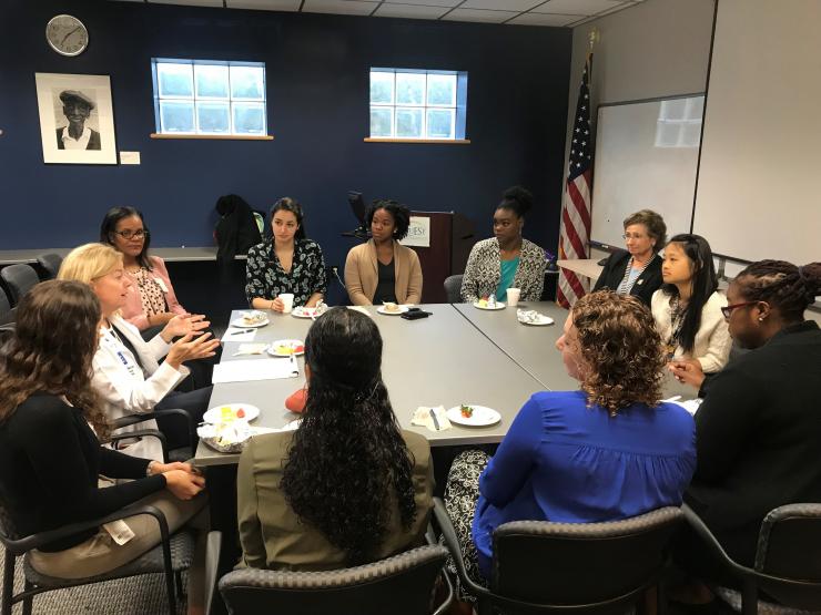 Photo of students, trainees, and faculty listening to Dr. Laura Petersen at the November 2017 Tacos with Teachers.