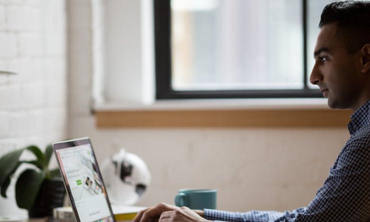 A person sitting at a desk in an office