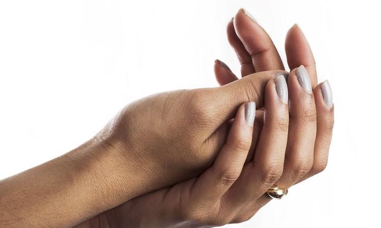 A woman's hands cupped together