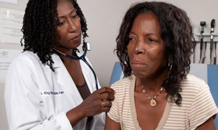A doctor examining a patient in a Baylor College of Medicine clinic. 
