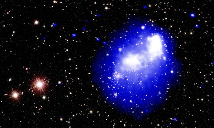 An image of deep space, with brightly colored lights against a backdrop of black void.