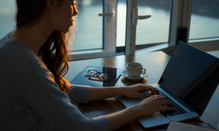 A person working at a laptop.