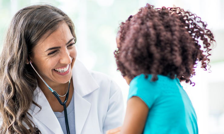 A doctor meeting with a young patient.