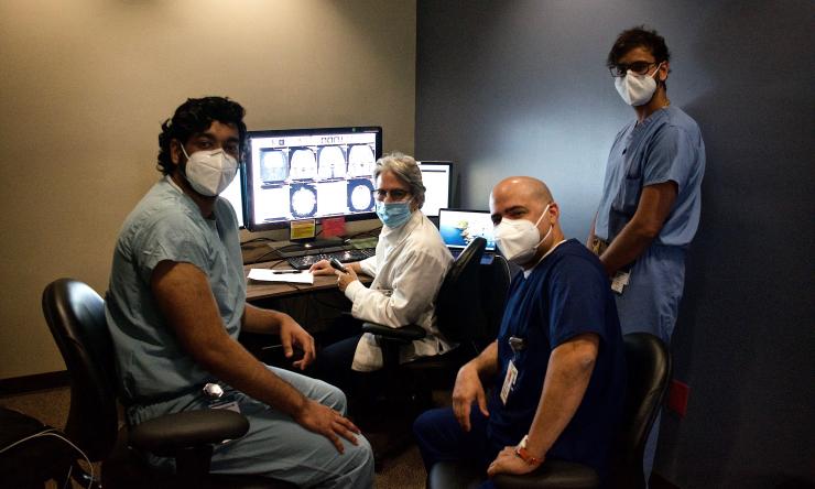 Residents and Faculty collaborating on a neuroradiology case at Ben Taub.