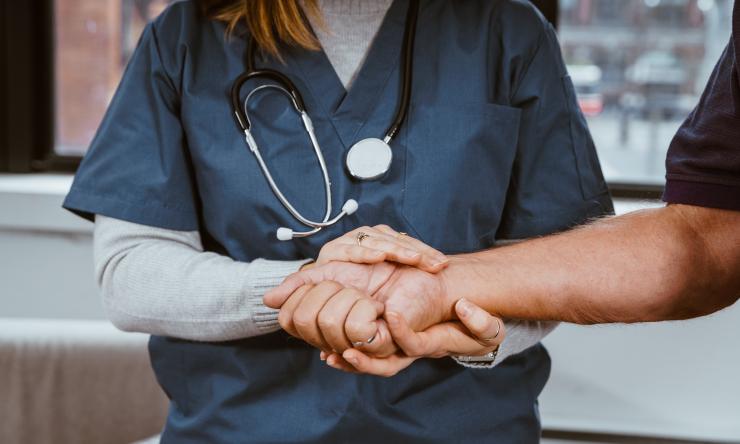 Nurse helping patient